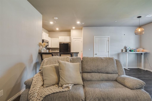 1010 SW 91st St, Oklahoma City, OK 73139 - living area featuring dark wood-style flooring and recessed lighting