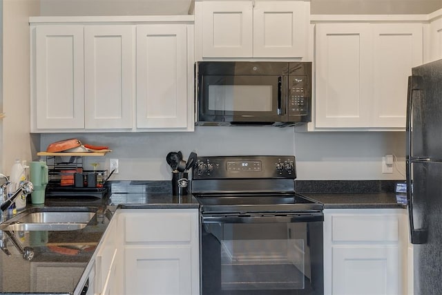 1010 SW 91st St, Oklahoma City, OK 73139 - kitchen with black appliances, white cabinetry, and dark stone countertops