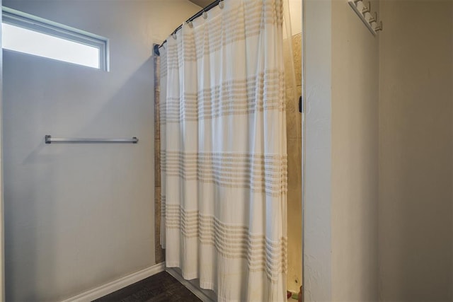 1010 SW 91st St, Oklahoma City, OK 73139 - bathroom featuring a shower with curtain and baseboards