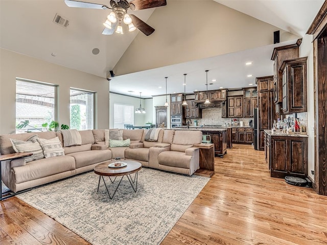 4311 Moorgate Dr, Norman, OK 73072 - living room with a ceiling fan, healthy amount of natural light, light wood-style floors, high vaulted ceiling, and recessed lighting