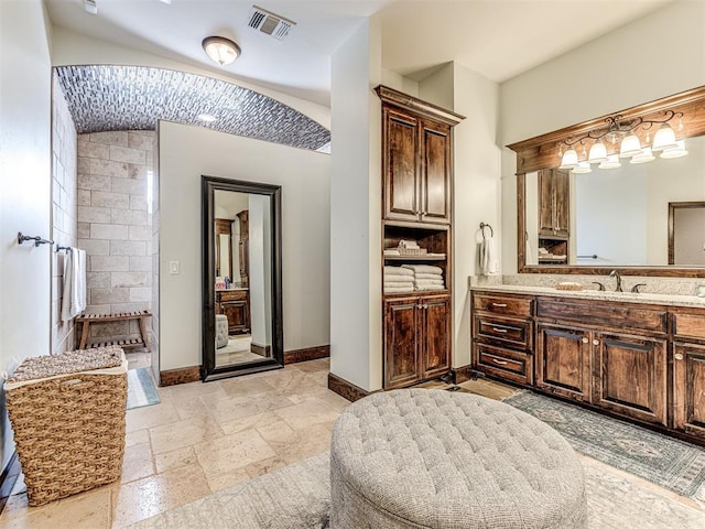 4311 Moorgate Dr, Norman, OK 73072 - bathroom with vanity, a walk in shower, and stone tile flooring