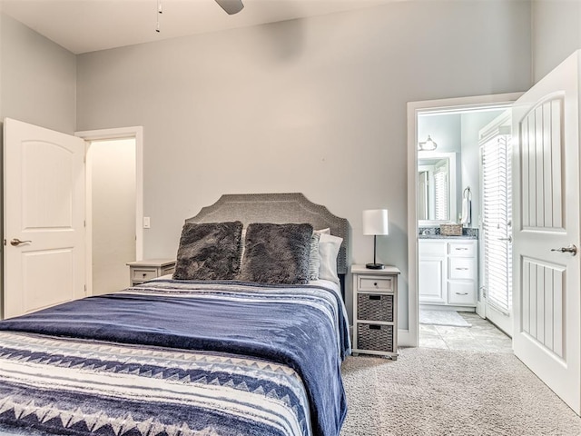 4311 Moorgate Dr, Norman, OK 73072 - bedroom with light colored carpet, ensuite bathroom, and a ceiling fan