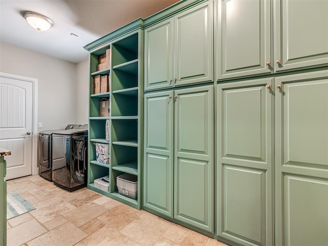 4311 Moorgate Dr, Norman, OK 73072 - washroom featuring washer and dryer, cabinet space, and stone tile flooring