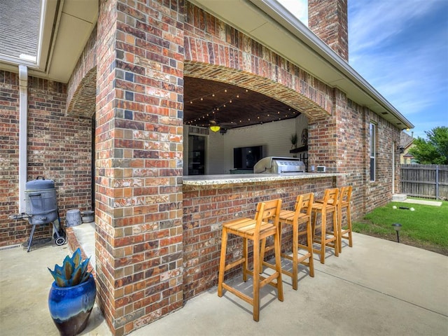 4311 Moorgate Dr, Norman, OK 73072 - view of patio featuring an outdoor kitchen