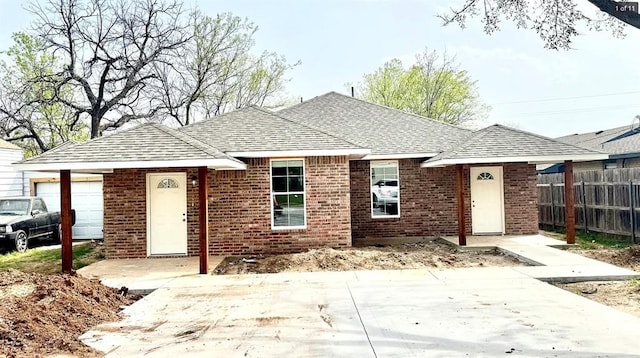 1614 SW C Ave, Lawton, OK 73501 - ranch-style home with brick siding, a garage, and a shingled roof