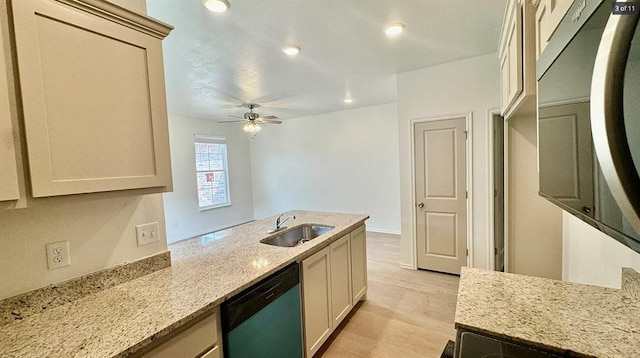 1614 SW C Ave, Lawton, OK 73501 - kitchen featuring dishwasher, a ceiling fan, light wood-type flooring, light stone counters, and a peninsula