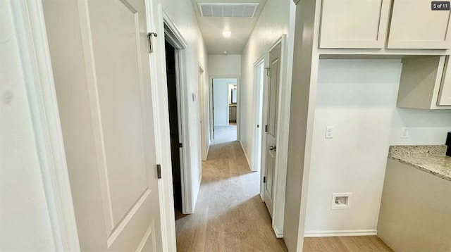 1614 SW C Ave, Lawton, OK 73501 - hallway featuring light wood-style flooring and baseboards