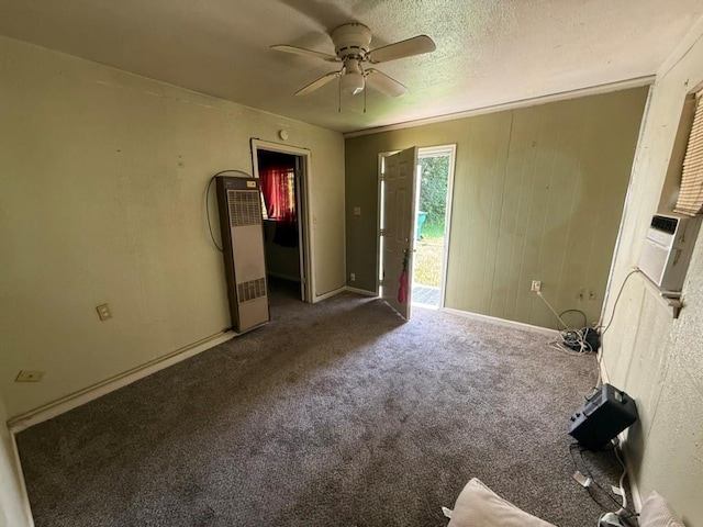 8821 NE 50th St, Spencer, OK 73084 - unfurnished bedroom with a heating unit, carpet flooring, access to outside, a ceiling fan, and a textured ceiling