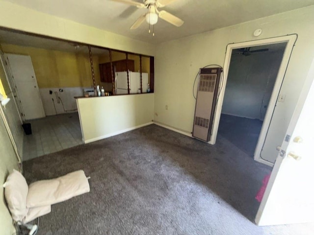 8821 NE 50th St, Spencer, OK 73084 - unfurnished living room with a heating unit, ceiling fan, and carpet flooring