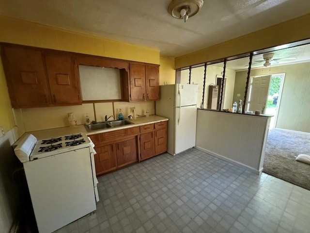 8821 NE 50th St, Spencer, OK 73084 - kitchen featuring white appliances, ceiling fan, light countertops, and tile patterned floors