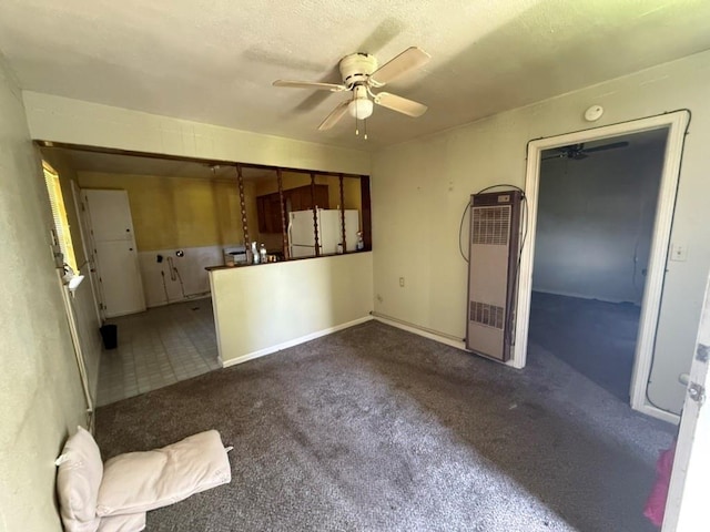 8821 NE 50th St, Spencer, OK 73084 - unfurnished living room featuring a heating unit, a ceiling fan, and carpet flooring