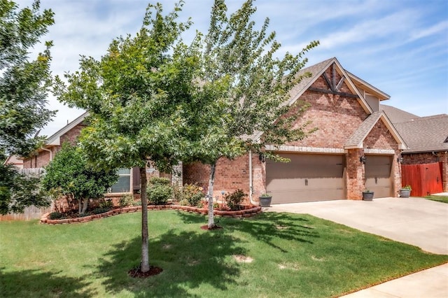 3309 Austrian Pine Ln, Yukon, OK 73099 - view of front of home with brick siding, a garage, driveway, and a shingled roof