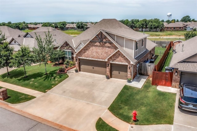 3309 Austrian Pine Ln, Yukon, OK 73099 - craftsman inspired home featuring brick siding, driveway, a garage, and a residential view