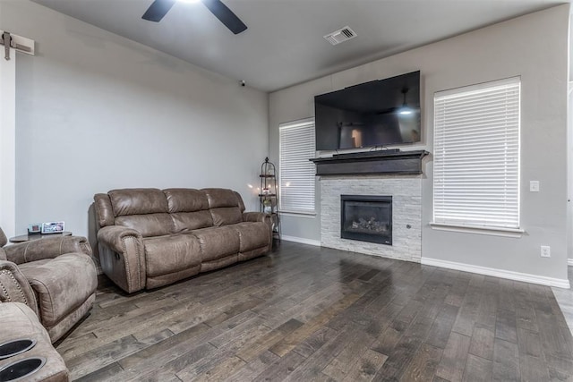 3309 Austrian Pine Ln, Yukon, OK 73099 - living room with hardwood / wood-style floors, a ceiling fan, and a stone fireplace