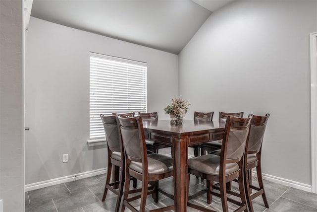 3309 Austrian Pine Ln, Yukon, OK 73099 - dining room with lofted ceiling and tile patterned floors