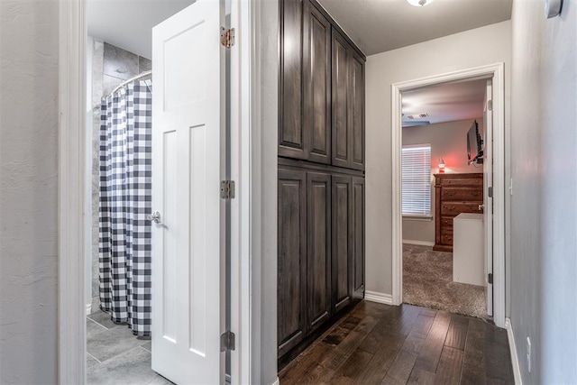 3309 Austrian Pine Ln, Yukon, OK 73099 - hall with dark wood finished floors and baseboards