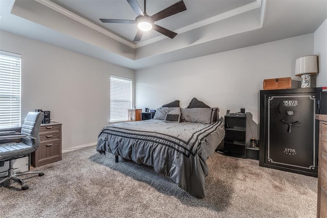 3309 Austrian Pine Ln, Yukon, OK 73099 - carpeted bedroom with a raised ceiling, ornamental molding, a desk, and a ceiling fan