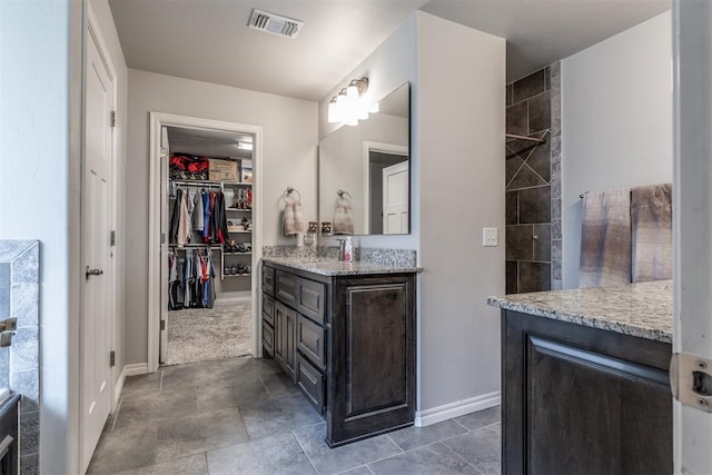 3309 Austrian Pine Ln, Yukon, OK 73099 - full bathroom featuring vanity and a walk in closet