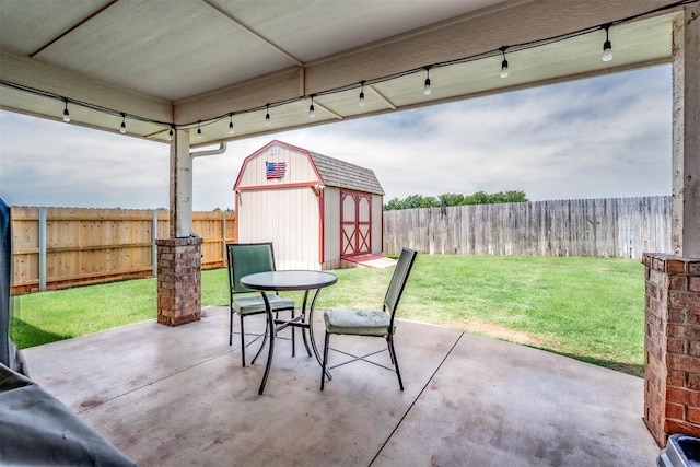 3309 Austrian Pine Ln, Yukon, OK 73099 - fenced backyard with a patio and a storage unit