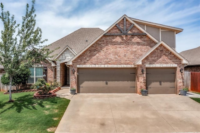 3309 Austrian Pine Ln, Yukon, OK 73099 - view of front of house featuring brick siding, a garage, driveway, and roof with shingles