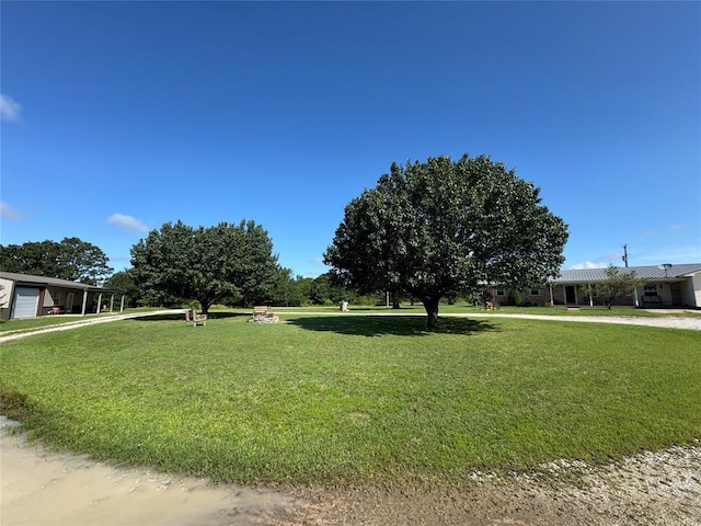 35352 Ew 1260th Rd, Seminole, OK 74868 - view of front of house with a front yard and a garage