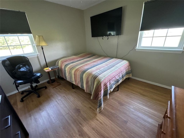 35352 Ew 1260th Rd, Seminole, OK 74868 - bedroom with multiple windows and wood finished floors