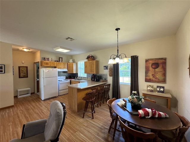 35352 Ew 1260th Rd, Seminole, OK 74868 - dining room with a chandelier and light wood-style flooring