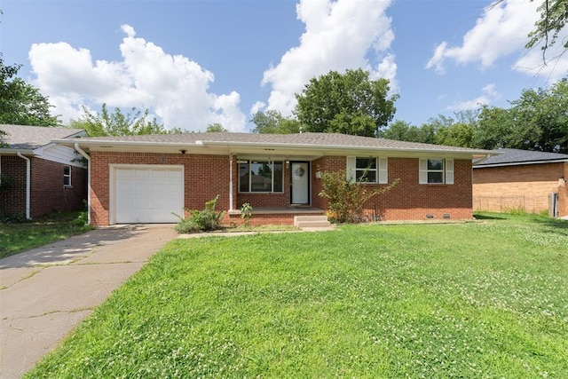 709 W Hughbert St, Norman, OK 73069 - ranch-style house featuring a garage, concrete driveway, brick siding, and a front yard