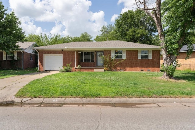 709 W Hughbert St, Norman, OK 73069 - ranch-style home with crawl space, an attached garage, brick siding, and driveway