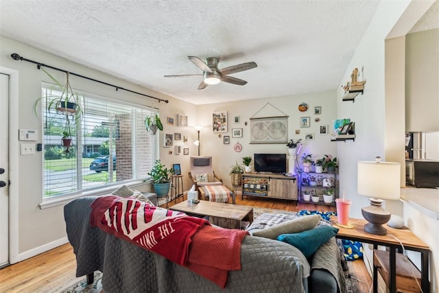 709 W Hughbert St, Norman, OK 73069 - living area with ceiling fan, wood finished floors, and a textured ceiling