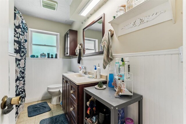 709 W Hughbert St, Norman, OK 73069 - full bath featuring wainscoting, vanity, and tile patterned flooring