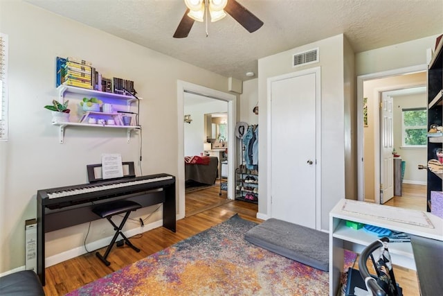 709 W Hughbert St, Norman, OK 73069 - office area featuring wood finished floors, a ceiling fan, and a textured ceiling