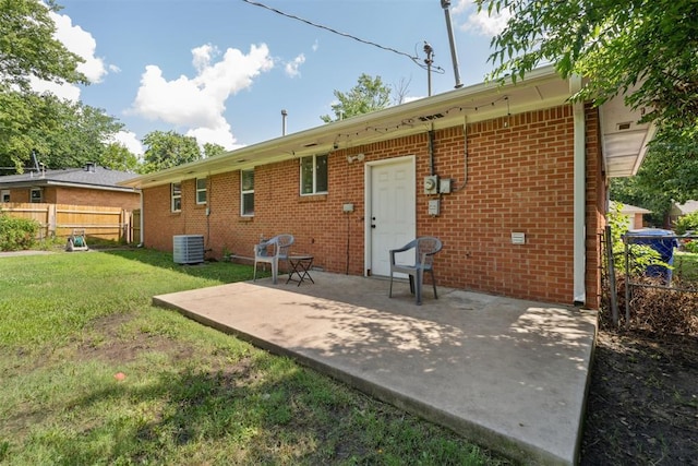 709 W Hughbert St, Norman, OK 73069 - rear view of property featuring brick siding and a patio