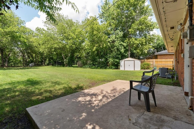 709 W Hughbert St, Norman, OK 73069 - view of yard featuring a storage unit, a patio, and view of scattered trees