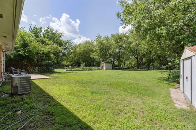 709 W Hughbert St, Norman, OK 73069 - fenced backyard with a storage shed and view of scattered trees
