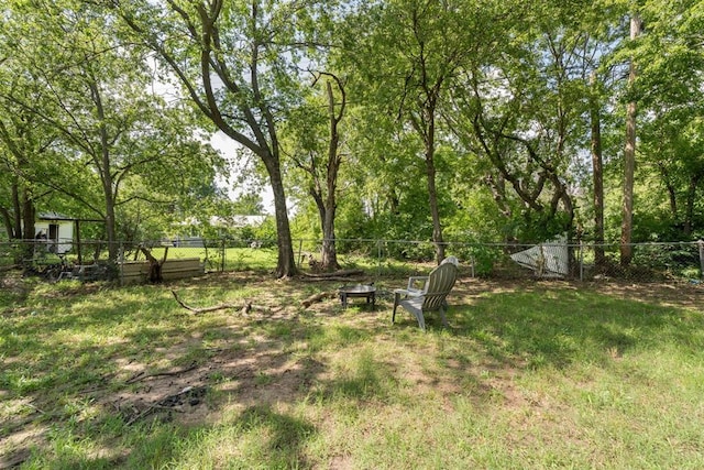 709 W Hughbert St, Norman, OK 73069 - fenced backyard with a fire pit