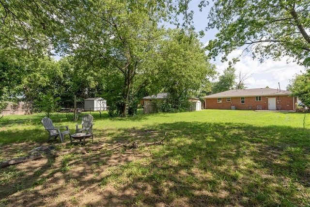 709 W Hughbert St, Norman, OK 73069 - view of yard featuring an outdoor fire pit