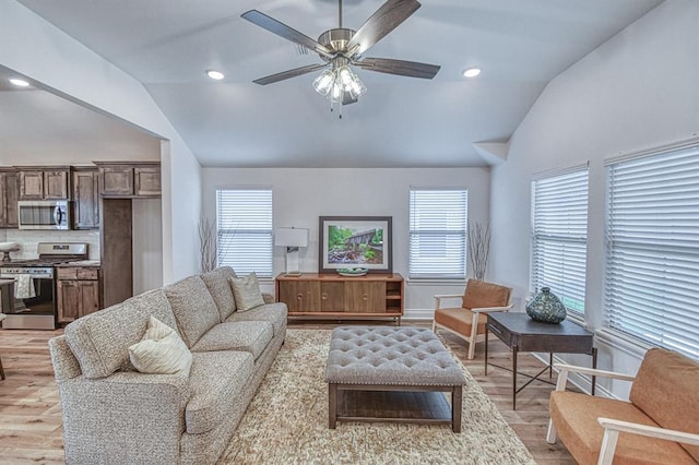 12712 NW 4th St, Yukon, OK 73099 - living area featuring vaulted ceiling, light wood-style floors, plenty of natural light, ceiling fan, and recessed lighting