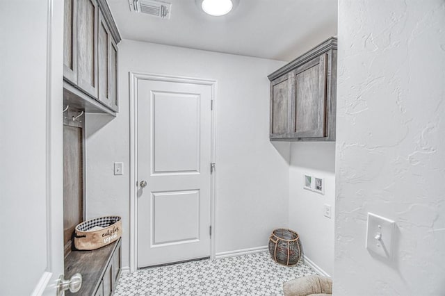 12712 NW 4th St, Yukon, OK 73099 - laundry area featuring cabinet space, light floors, and washer hookup