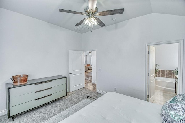 12712 NW 4th St, Yukon, OK 73099 - bedroom featuring lofted ceiling, ensuite bathroom, and a ceiling fan