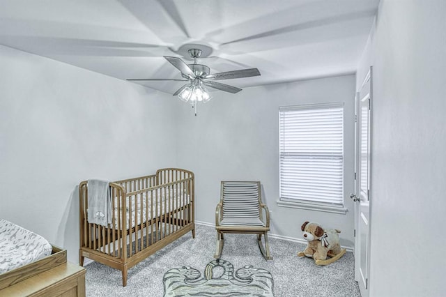 12712 NW 4th St, Yukon, OK 73099 - carpeted bedroom with a nursery area and ceiling fan