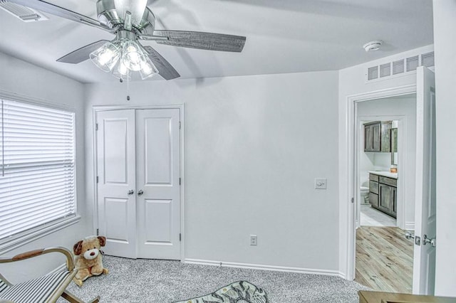 12712 NW 4th St, Yukon, OK 73099 - unfurnished bedroom featuring a closet, ceiling fan, and carpet flooring