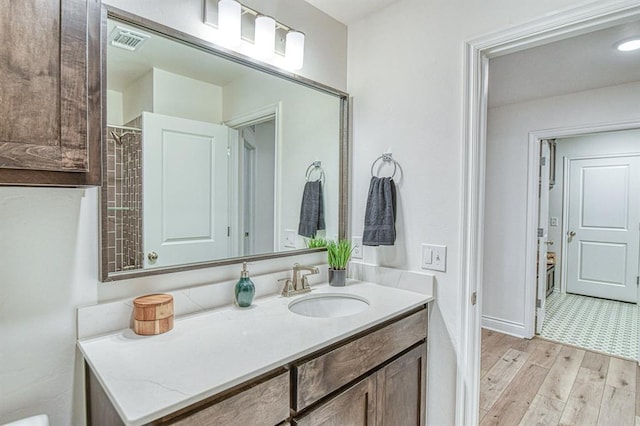 12712 NW 4th St, Yukon, OK 73099 - bathroom featuring vanity and wood finished floors