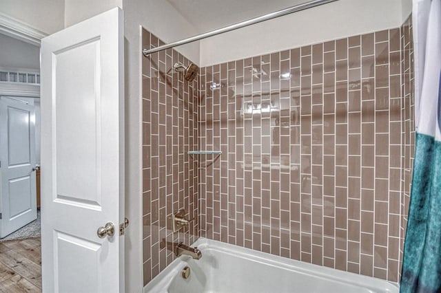 12712 NW 4th St, Yukon, OK 73099 - full bathroom featuring shower / bath combo and wood finished floors