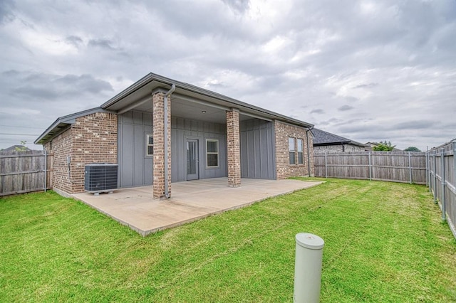 12712 NW 4th St, Yukon, OK 73099 - back of house with a fenced backyard, a patio, and brick siding