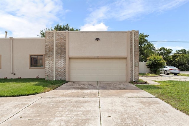 12725 Silver Ln, Oklahoma City, OK 73120 - view of front of property with stucco siding, concrete driveway, a front yard, and a garage