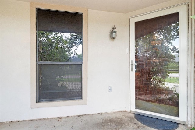 12725 Silver Ln, Oklahoma City, OK 73120 - property entrance featuring stucco siding