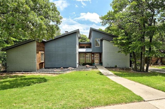 1810 Sandpiper Dr, Edmond, OK 73034 - view of front facade featuring brick siding and a front lawn