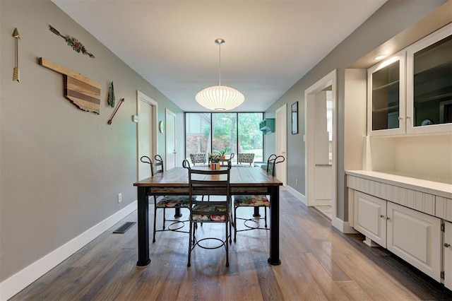 1810 Sandpiper Dr, Edmond, OK 73034 - dining area featuring dark wood finished floors and baseboards