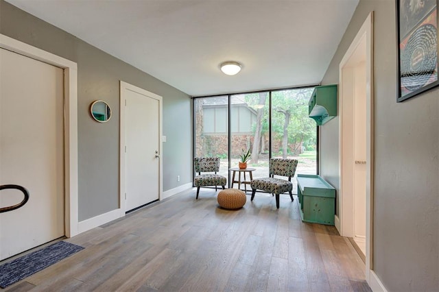 1810 Sandpiper Dr, Edmond, OK 73034 - sitting room with light wood-style floors and expansive windows